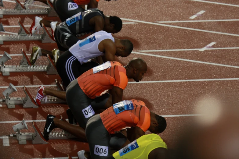 athletes knee down in pain at the start line