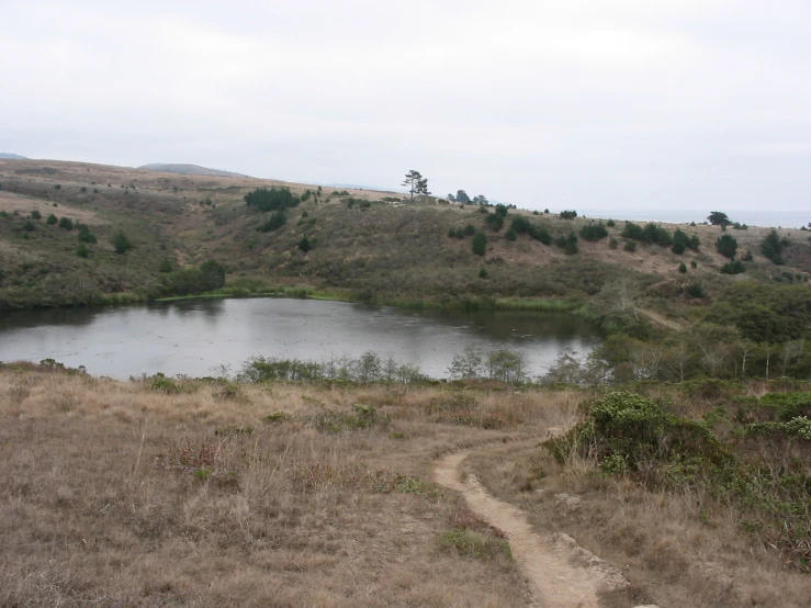 a path leads up to a small lake