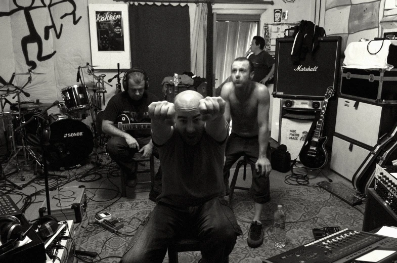 a group of men playing instruments in a room