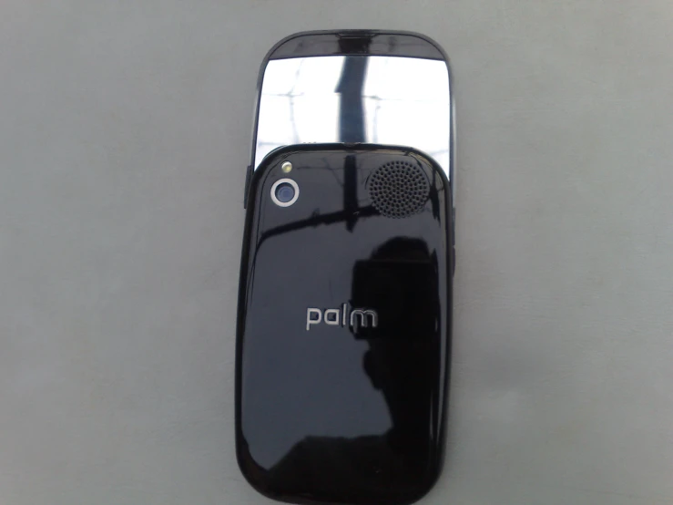 a back view of a palm phone sitting on a table
