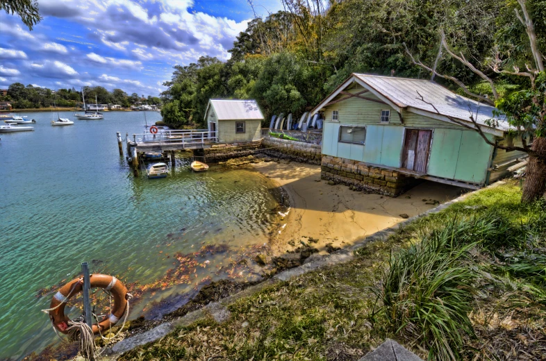 some boats that are in the water by a dock