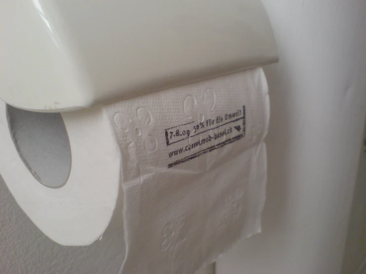 a closeup po of a toilet with toilet paper on it