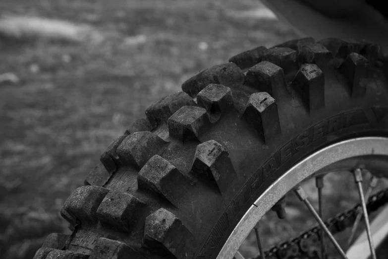 a bike tire with cubed tread and a small wheel