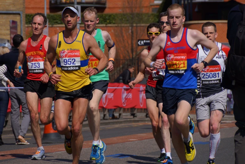 a marathon is shown with three men running