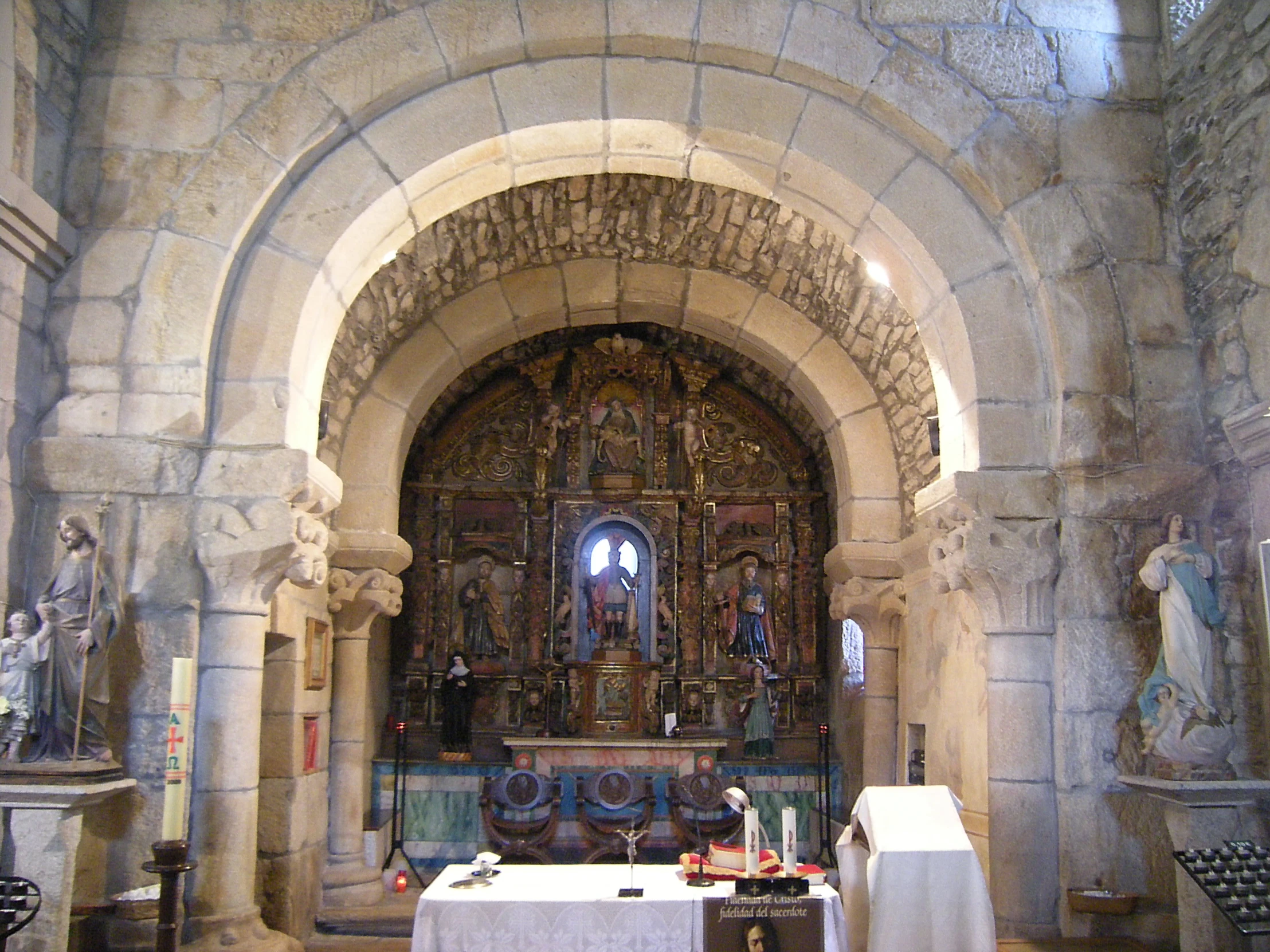 an ornate cathedral, decorated with statues and paintings