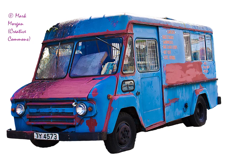 an old van that has been painted red, white and blue