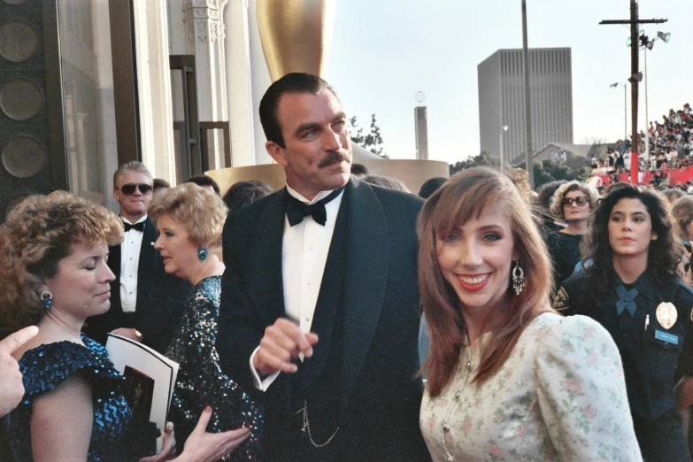 man in a tuxedo and woman at an event