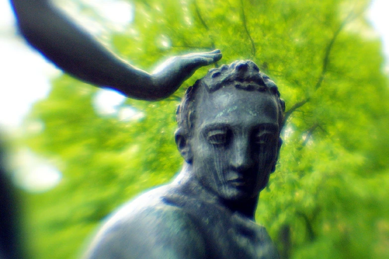 a statue of a woman holding her hand out for balance