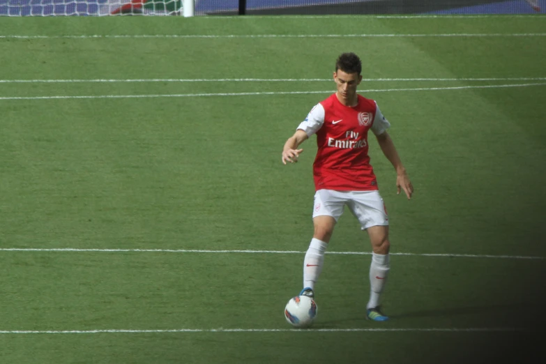 a man playing soccer on a soccer field