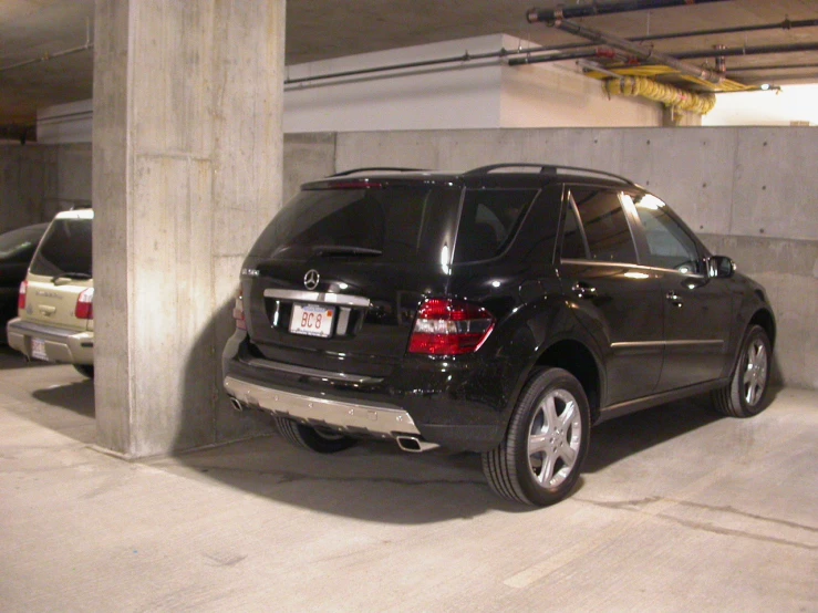 a car in the garage near several cars parked