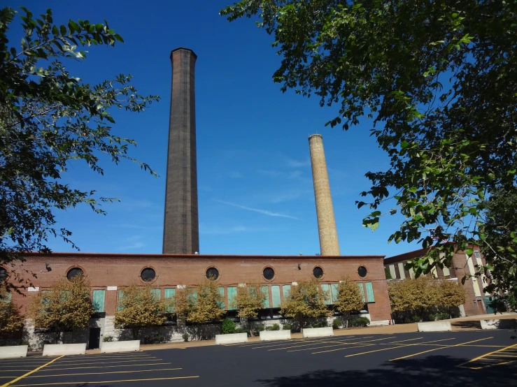 an industrial plant sitting next to a road