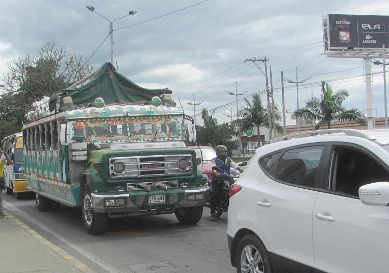 some vehicles are parked along a side walk