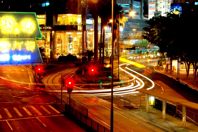 traffic is driving through a busy intersection in the city