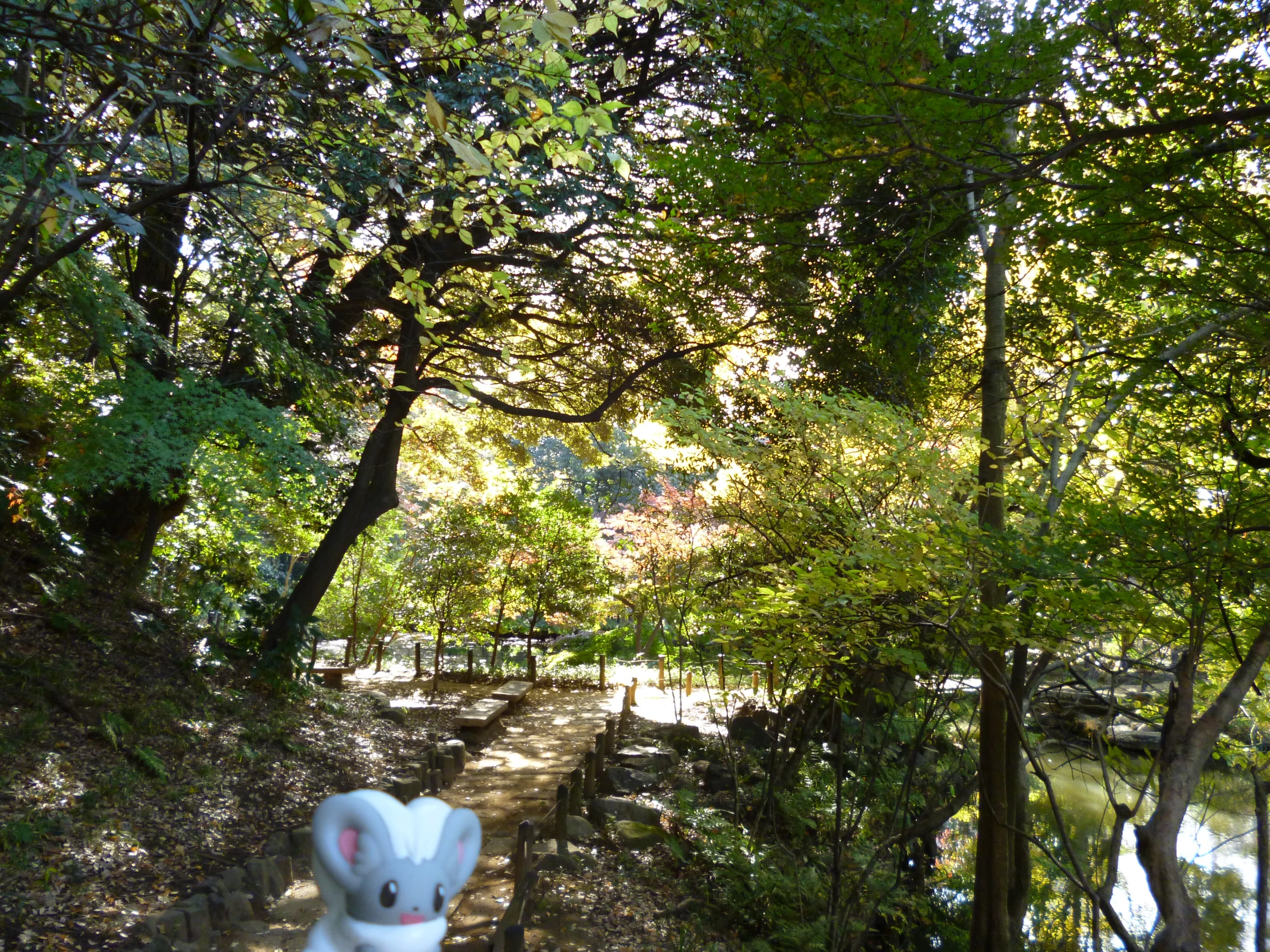 an odd stuffed toy in the middle of a park