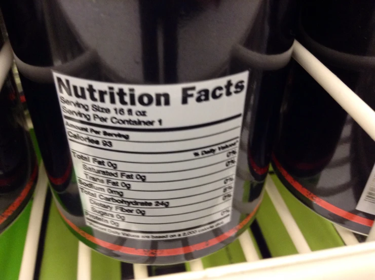 a closeup of the nutrition label on the back of an open fridge