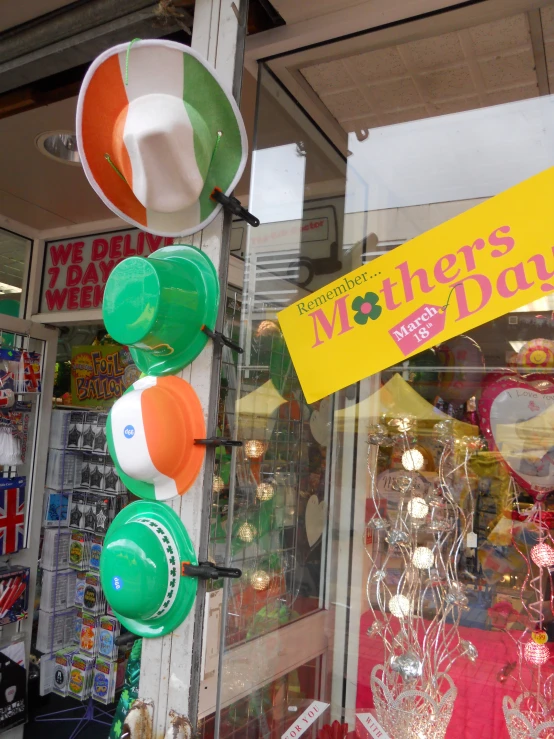 a storefront with balloons and other colorful objects