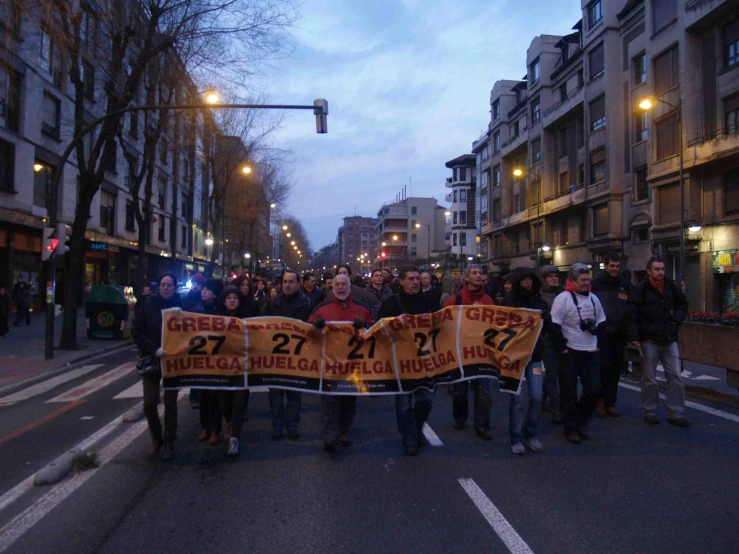 a large group of people protesting on the street