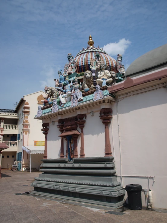 a large white building with many statues on the side of it