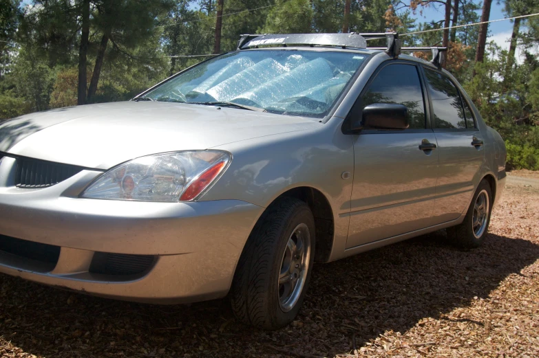 a silver vehicle that has some lights on