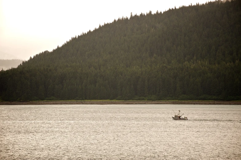 a lone boat is seen in the waters