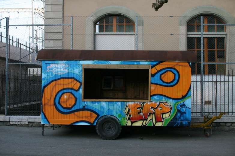 a brightly colored vehicle that has been decorated with graffiti