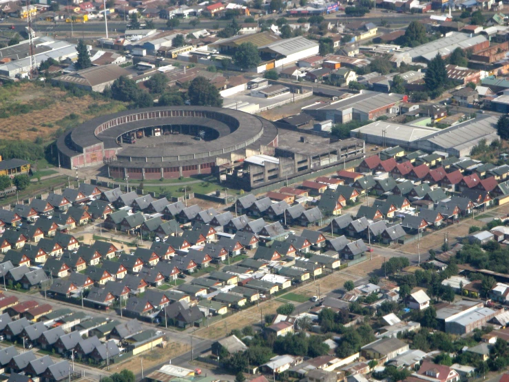 an aerial view of some houses in a city