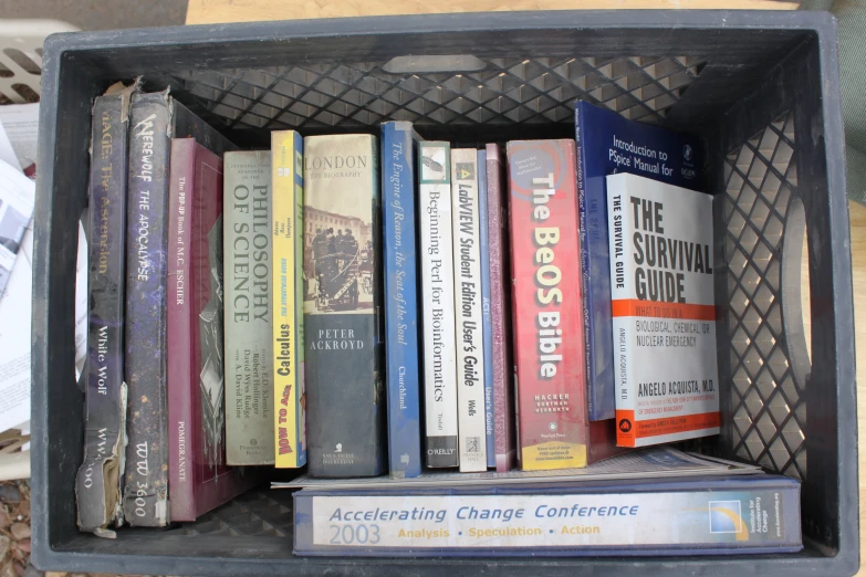 an open metal box with a bunch of books