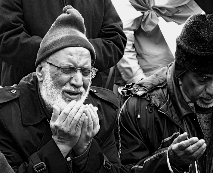 a man is staring in pain as he listens to his cell phone