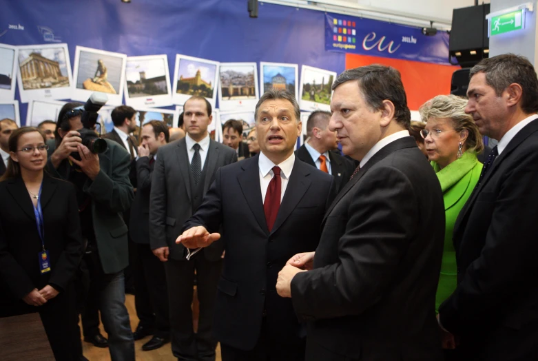 a group of people wearing suits and ties