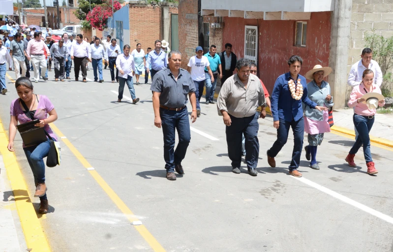 a group of people walking down the street