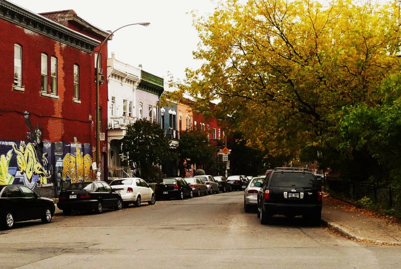 a city street lined with red brick buildings