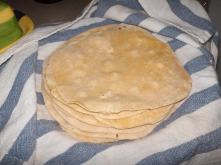 a couple of pieces of bread sit on top of a towel