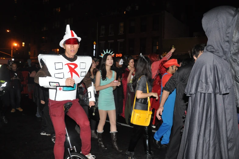 a man wearing a costume standing next to a woman