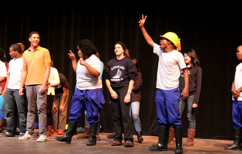 a crowd of children standing on a stage