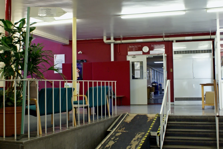 a long, metallic hand rail leading to a living room area