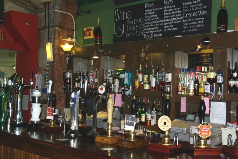 various items of wine hanging on the walls at a bar