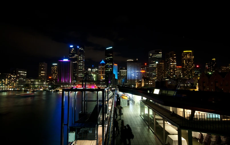 a city at night with lights reflected in water