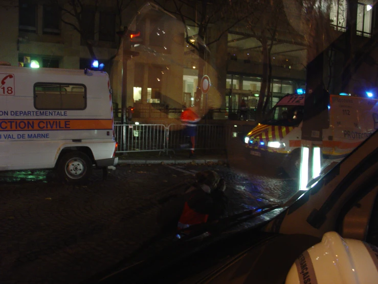 an ambulance on a street at night with bright lights