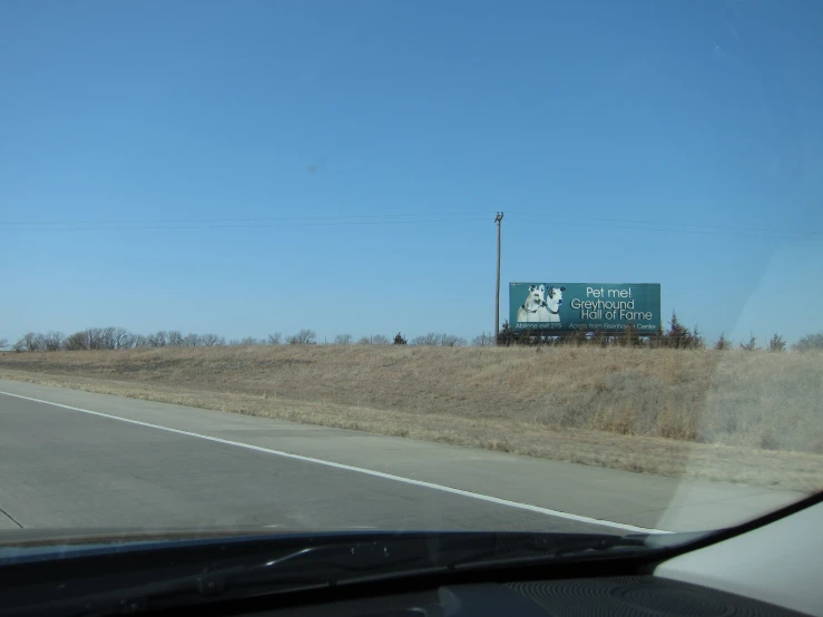 an advertising billboard that is in the distance