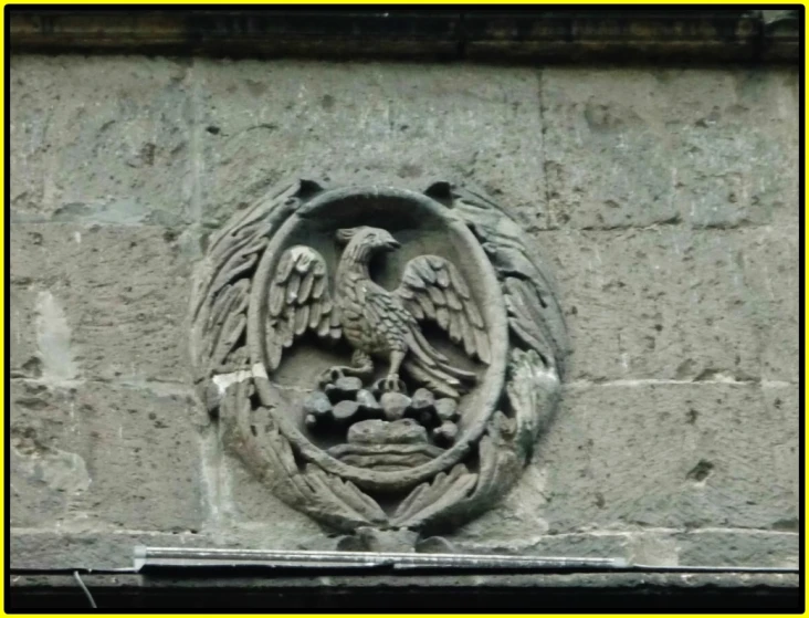 there is an emblem carved in the center of a stone object