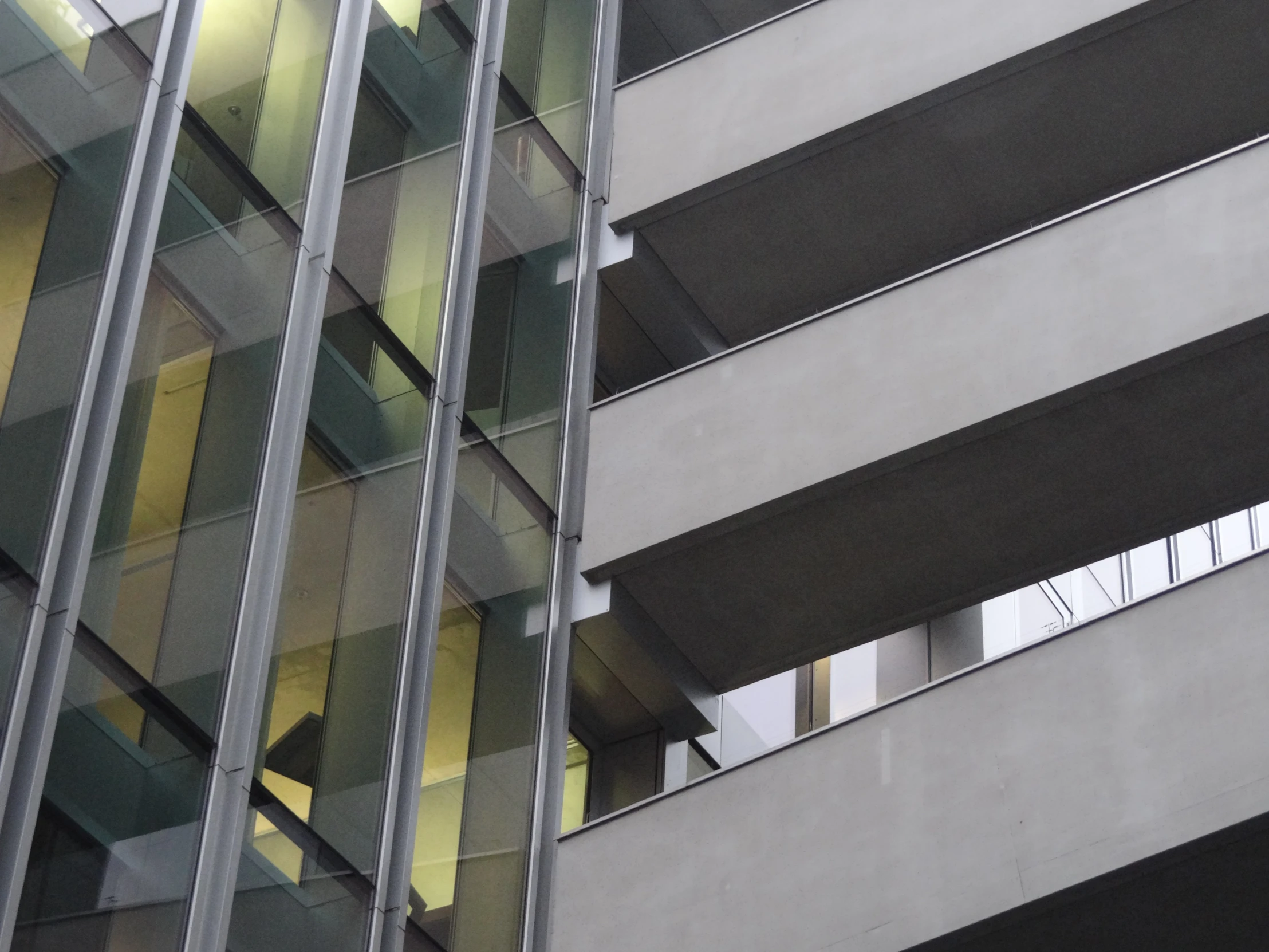 a tall glassy building with very large windows