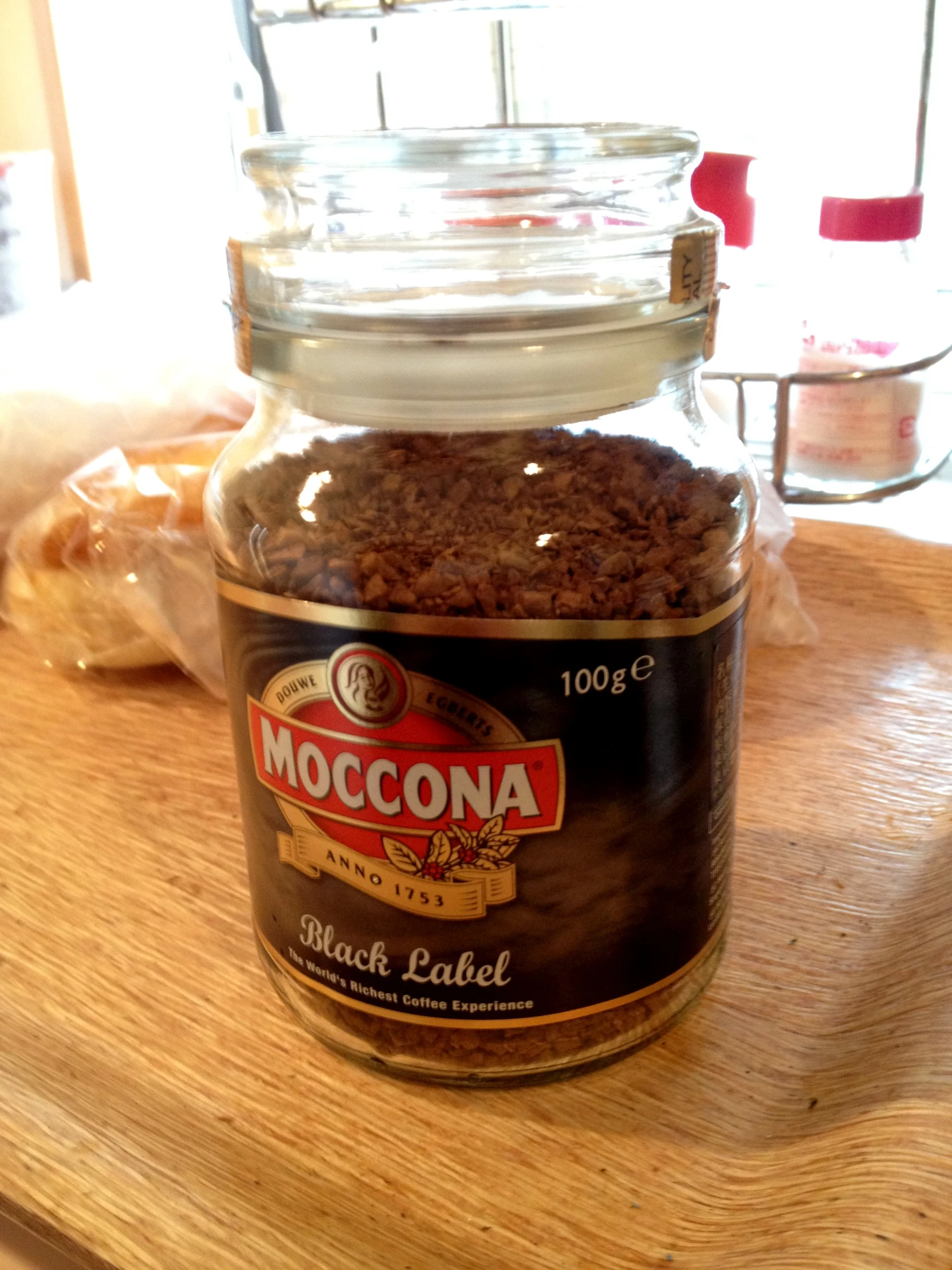 a jar filled with food sitting on top of a wooden counter