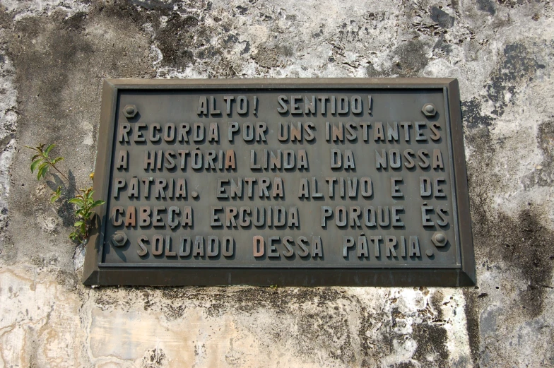 a black plaque on a stone wall stating that it is not to retrieving the date