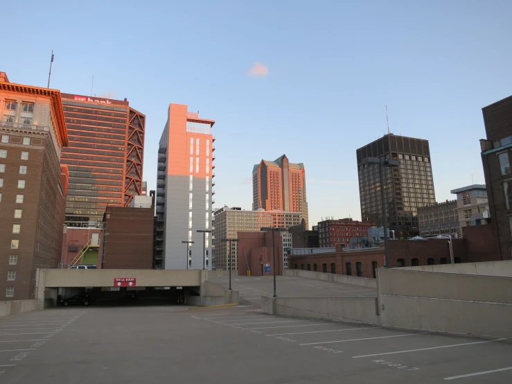 a parking lot in front of buildings with a fire hydrant