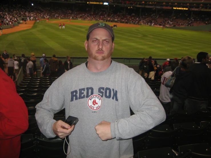 man standing with two cell phones in his hands