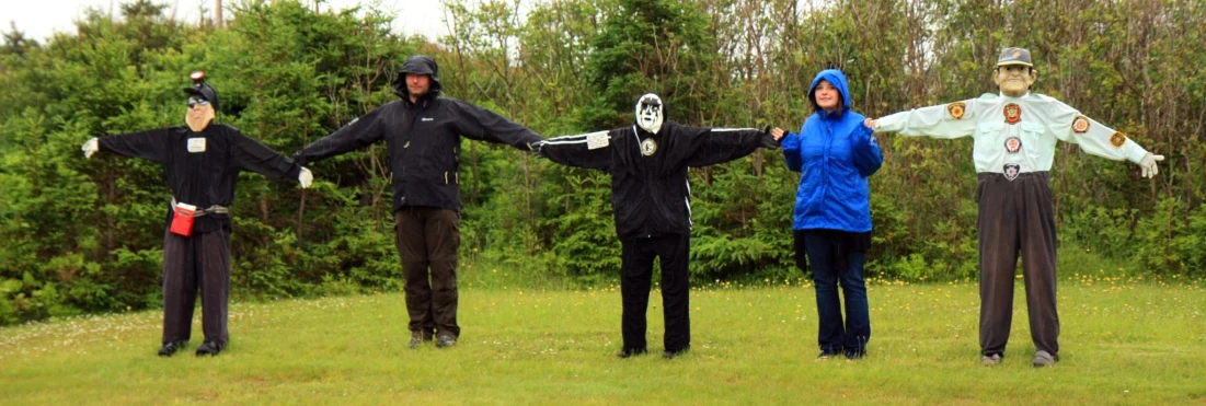 a group of four people dressed up with skeleton masks