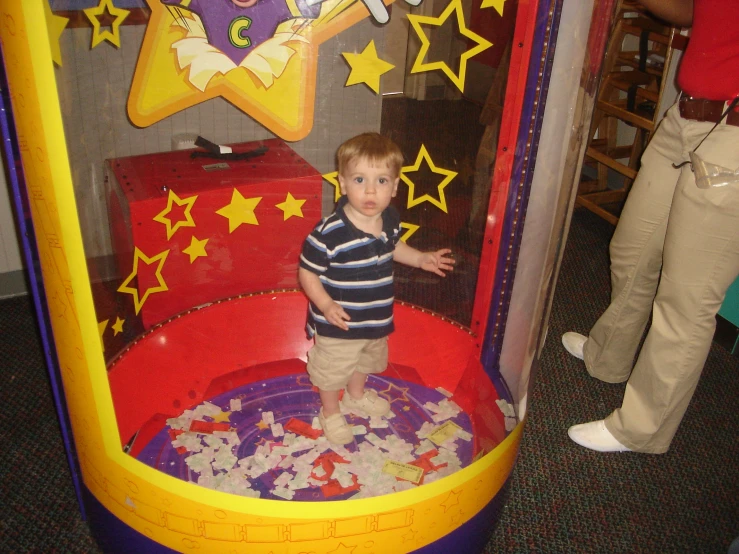 the boy is having fun playing in his bubble game