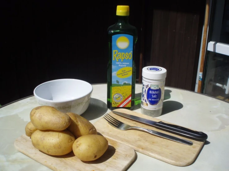 there is a plate of potato chips, er, fork and condiments