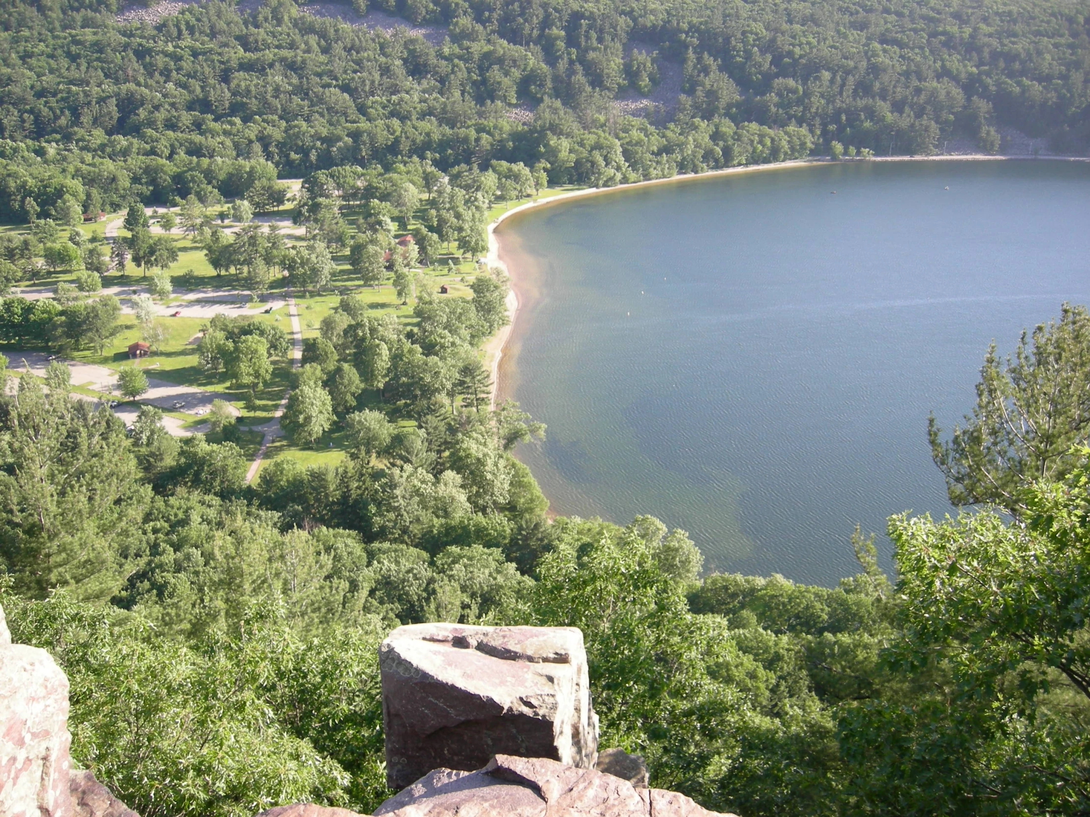 a view from a high hill of a lake