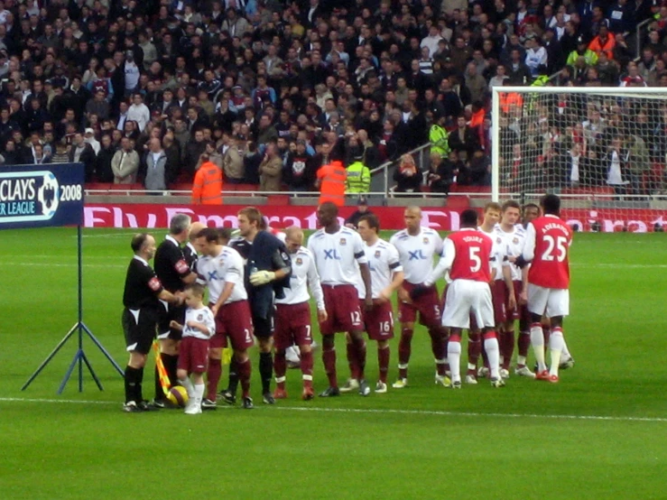 many players in the team stand around